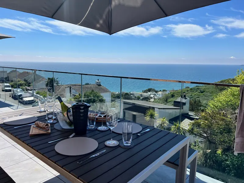 Outdoor dining table on the terrace overlooking the sea
